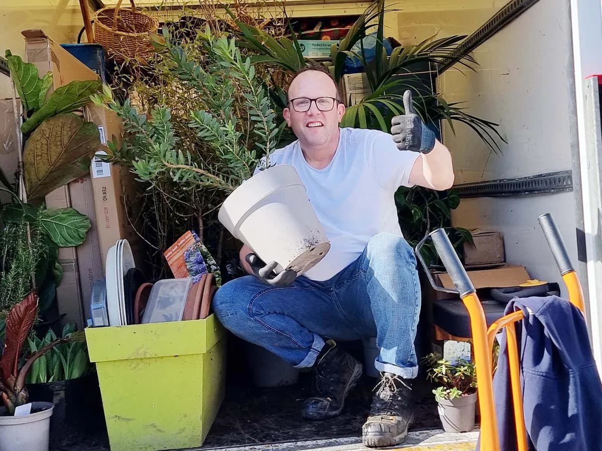 Nigel loading plants and garden items into the van on a Bristol house clearance